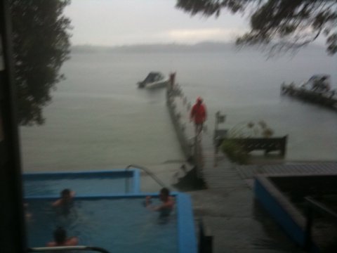 NZ: relaxing in hot thermal mineral water pools in the sunset.