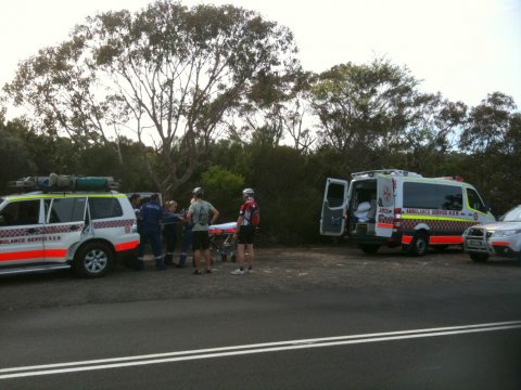 Dibbler being transferred to another ambulance at trail head